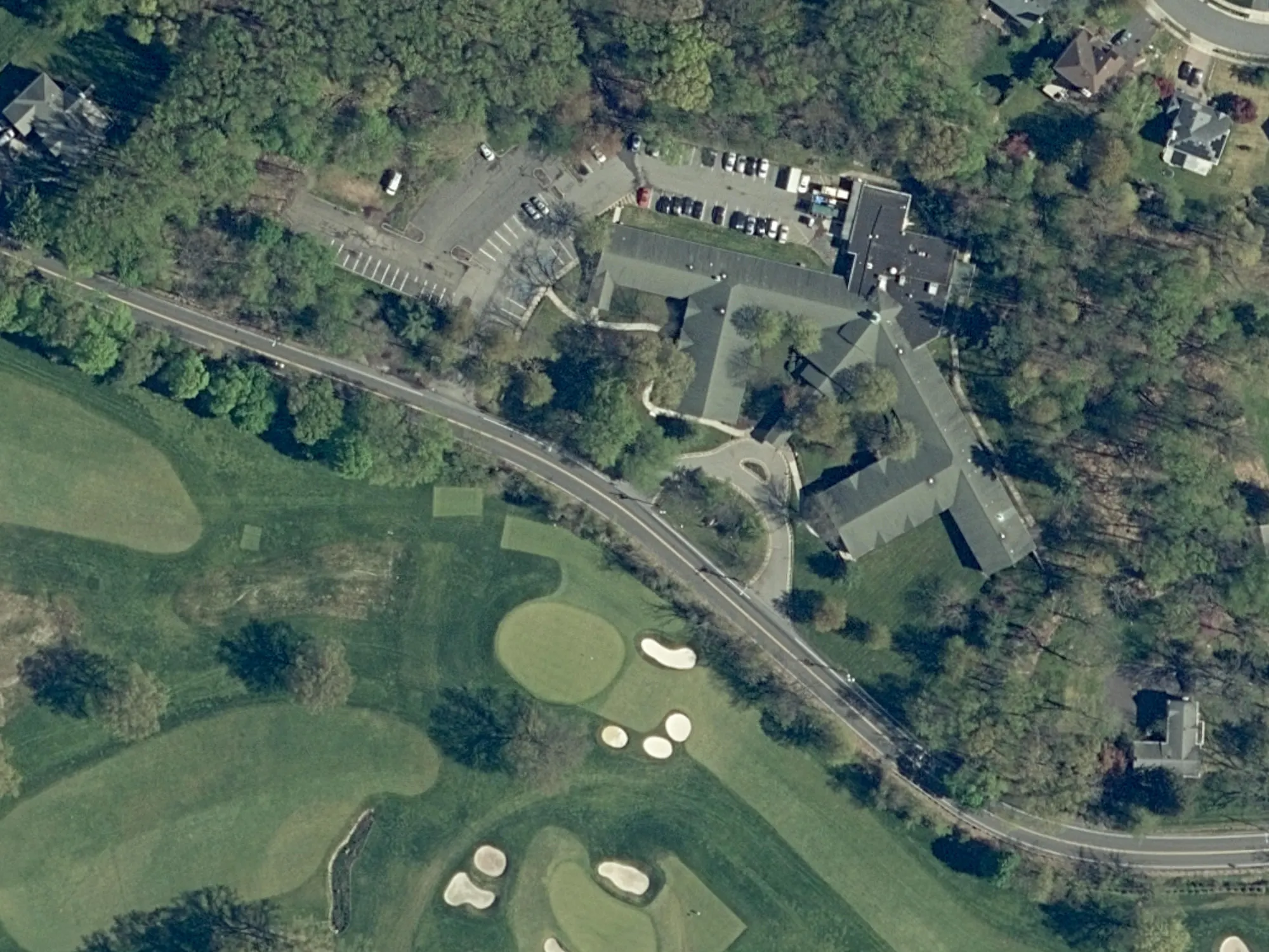 Aerial photo of the existing CareOne building and the wooded application lots along Inman Avenue, with the lot lines outlined